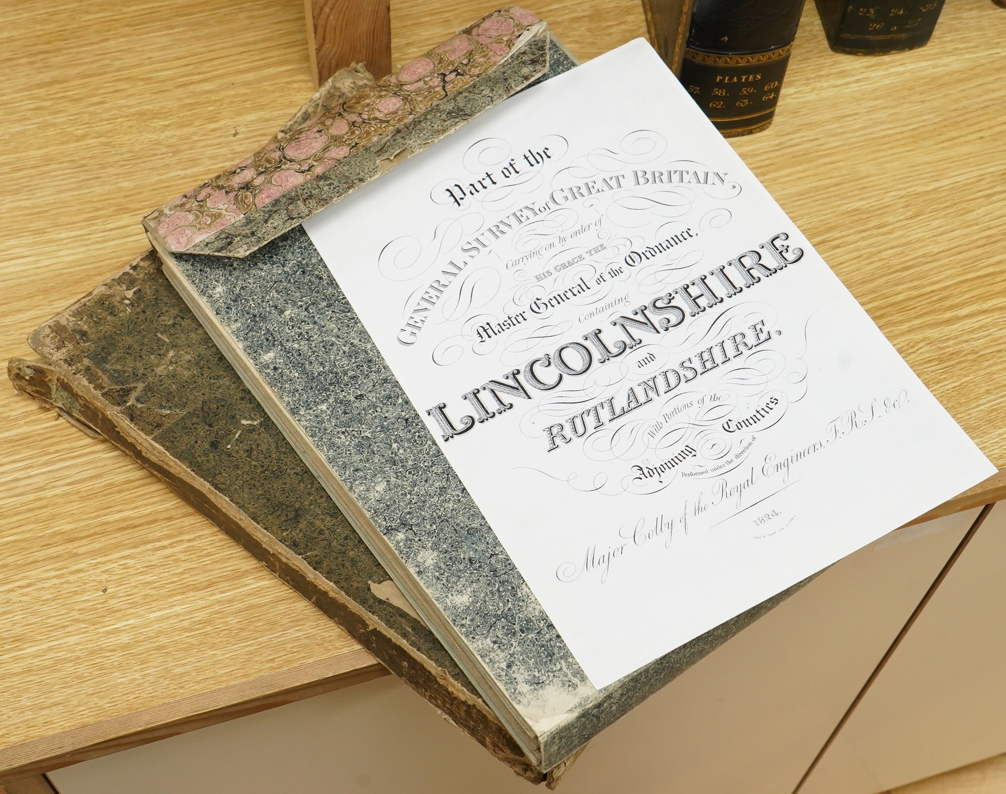 Ordnance Survey maps of Lincolnshire, Rutlandshire, N. Huntingdonshire and W. Norfolk &c., comprising of a set of eight engraved maps mounted on linen and edged in green cotton, including sheet no.s; 64, 65, 69, 70, 83,